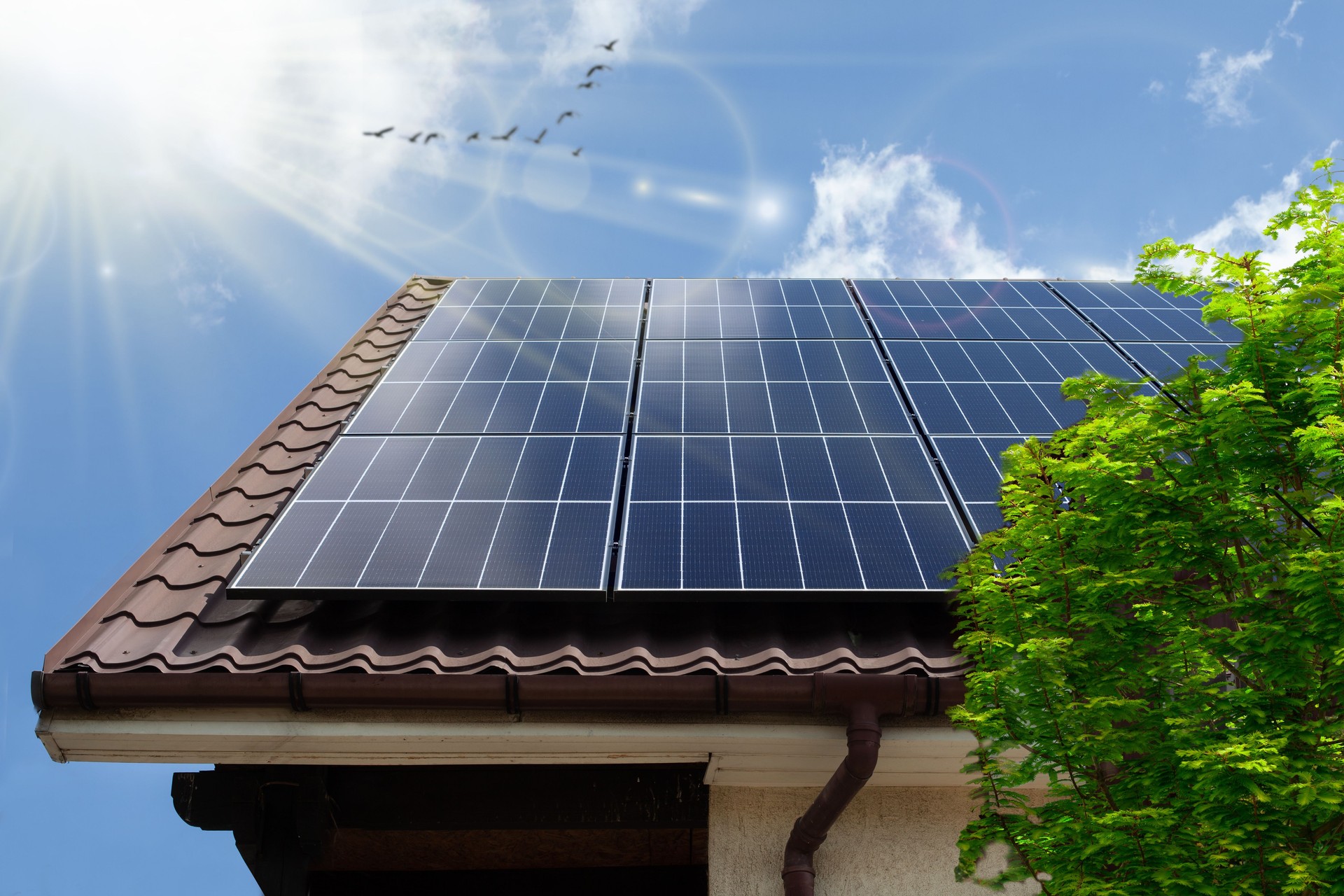 Solar photovoltaic panels on a house roof. ECO CONCEPTUAL